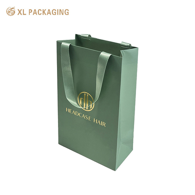 comprar Design personalizado Impressão de compras Embalagem de presente Saco de papel com o seu próprio logotipo Faixa verde de luxo Saco de papel espesso para roupas online manufacture