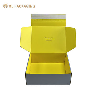 Caixas de correio corrugadas personalizadas para cosméticos. Caixas de envio de luxo cinza e amarelo com logotipo. Facil tira de lágrimas para produtos de beleza.